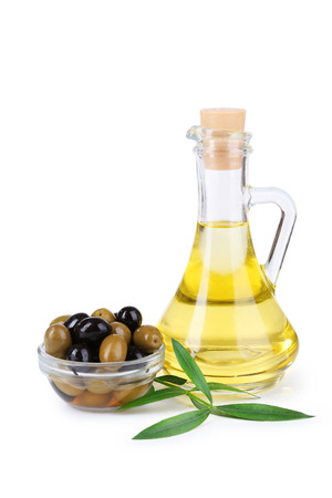 Green and black olives isolated on whiteの写真素材