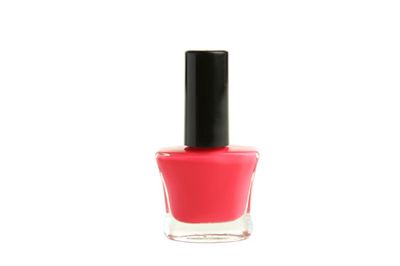 Pink nail polish bottle isolated on whiteの写真素材