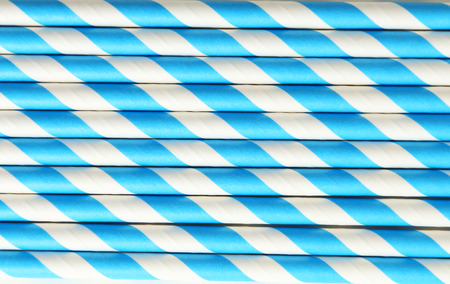 Striped straws for cocktails on white backgroundの写真素材