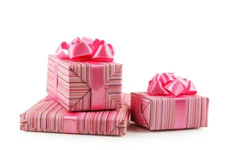 Gift box with pink bow isolated on whiteの写真素材