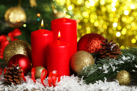 Christmas balls and candles on grey wooden backgroundの写真素材
