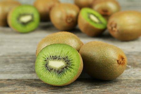 Kiwi fruit on grey wooden backgroundの写真素材