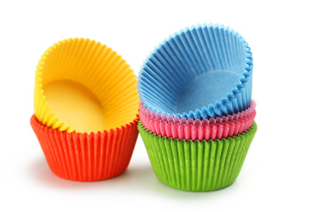 Empty colorful cupcake cases isolated on whiteの写真素材
