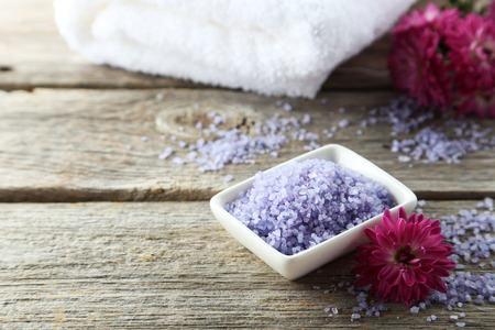Sea salt in white bowl on grey wooden backgroundの写真素材