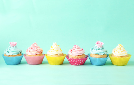 Birthday cupcakes on green backgroundの写真素材