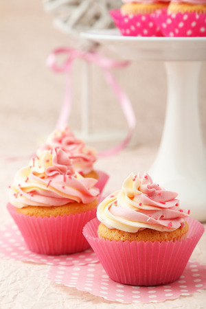 Tasty cupcake on pink backgroundの写真素材
