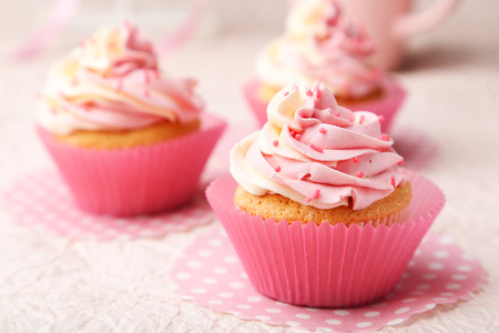 Tasty cupcake on pink backgroundの写真素材