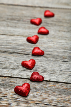 Love hearts on grey wooden backgroundの写真素材
