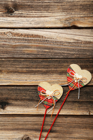 Love hearts on brown wooden backgroundの写真素材
