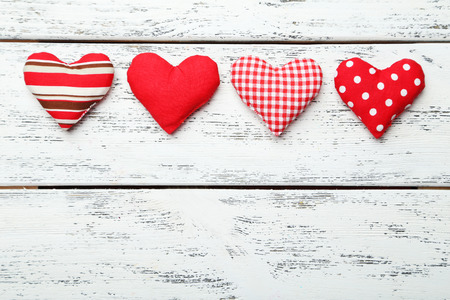 Love hearts on white wooden background