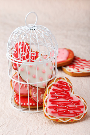 Heart cookies on pink paper backgroundの写真素材