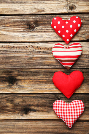 Love hearts on brown wooden backgroundの写真素材