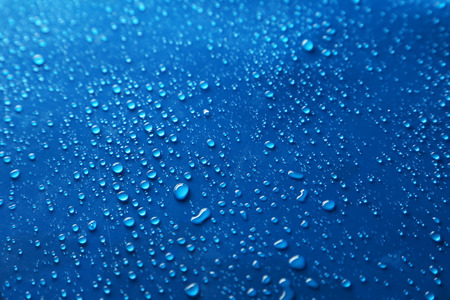Water drops on blue backgroundの写真素材