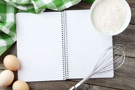 Open blank recipe book on grey wooden backgroundの写真素材