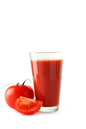 Fresh red tomatos and tomato juice in glass isolated on whiteの写真素材