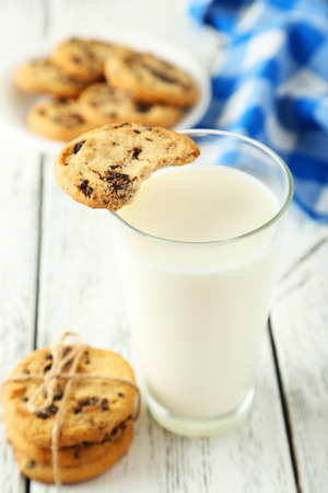 Glass of milk on white wooden backgroundの写真素材