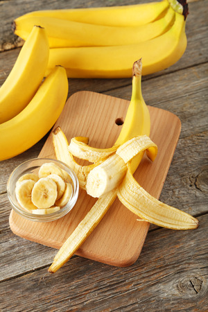 Bananas on grey wooden backgroundの写真素材