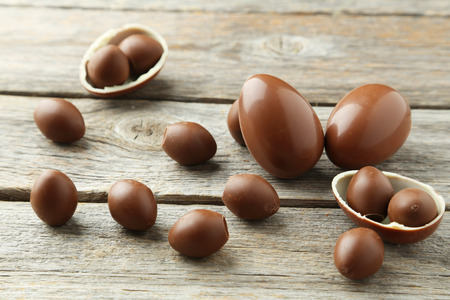 Chocolate easter eggs on grey wooden backgroundの写真素材