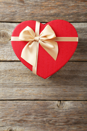 Beautiful heart gift box on grey wooden backgroundの写真素材