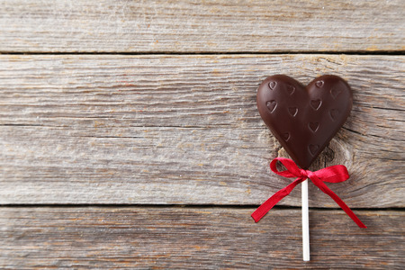 Chocolate hearts on grey wooden backgroundの写真素材