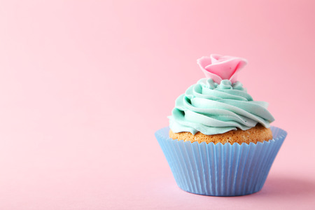 Tasty cupcake on pink backgroundの写真素材