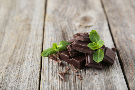 Fresh mint with chocolate on grey wooden backgroundの写真素材