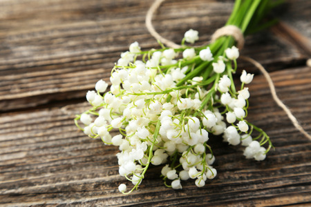 Lily of the Valley on brown wooden backgroundの写真素材