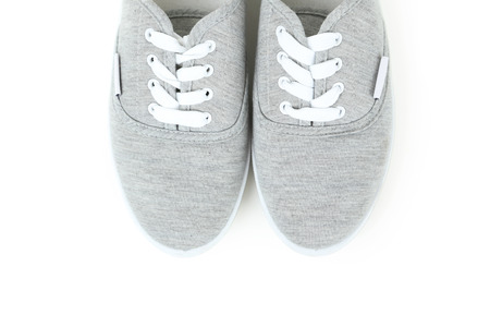 Pair of grey shoes on white backgroundの写真素材