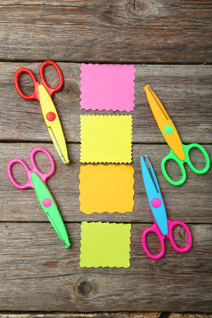 Figured scissors on grey wooden backgroundの写真素材