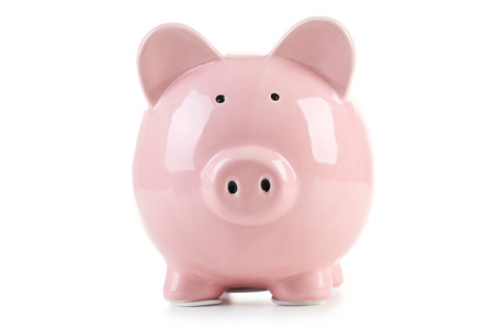Pink piggy bank isolated on a whiteの写真素材