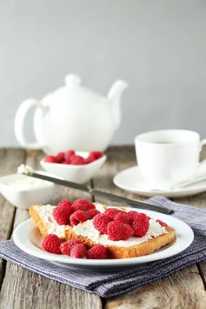 Fresh toast with raspberry on grey wooden backgroundの写真素材