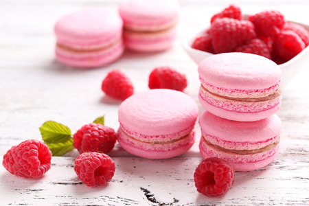 Raspberry macarons on white wooden backgroundの写真素材