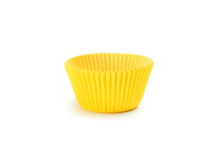 Yellow empty cupcake case isolated on whiteの写真素材