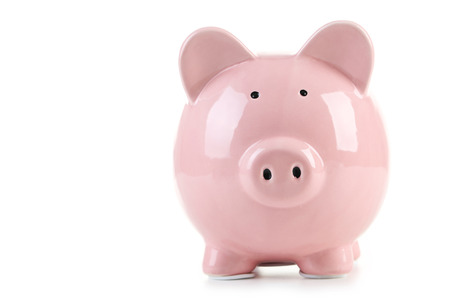 Pink piggy bank isolated on a whiteの写真素材