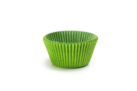 Green empty cupcake cases isolated on whiteの写真素材