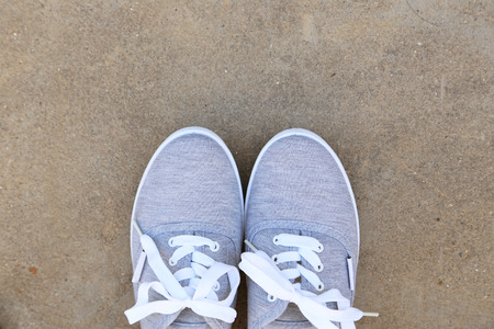 Pair of grey shoes outdoorsの写真素材