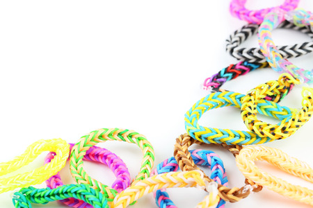 Colorful rubber band bracelets on white backgroundの写真素材