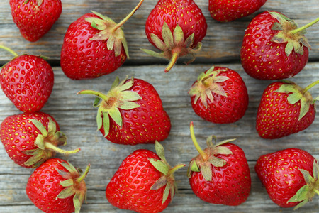 Strawberries berry of grey wooden background