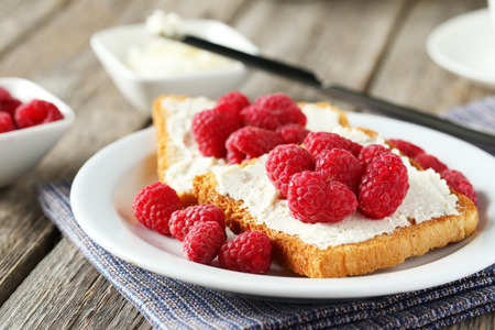 Fresh toast with raspberry on grey wooden backgroundの写真素材