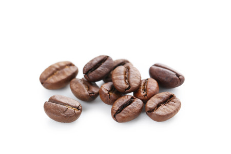 Roasted coffee beans isolated on a whiteの写真素材