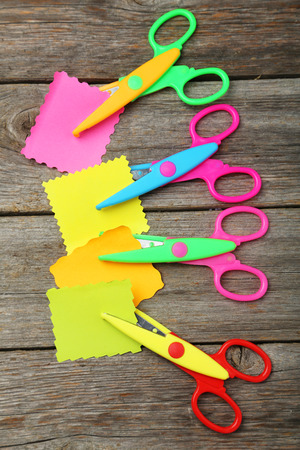 Figured scissors on grey wooden backgroundの写真素材