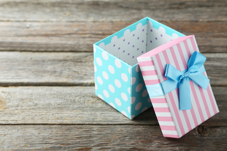 Beautiful gift box on grey wooden background