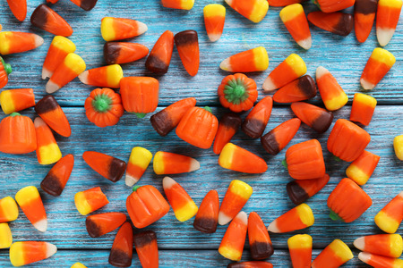 Halloween candy corns on blue wooden backgroundの写真素材