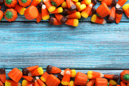 Halloween candy corns on blue wooden backgroundの写真素材