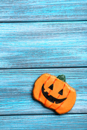 Fresh halloween gingerbread cookies on blue wooden tableの写真素材
