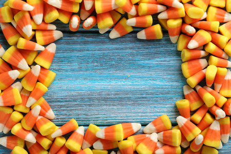 Halloween candy corns on blue wooden backgroundの写真素材