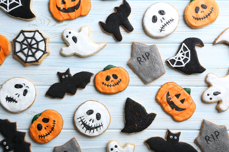 Fresh halloween gingerbread cookies on blue wooden tableの写真素材