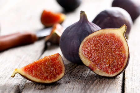 Fresh figs on a grey wooden tableの写真素材