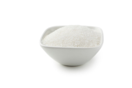White sugar in bowl isolated on whiteの写真素材