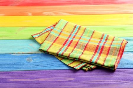 Napkin on colorful wooden table, close upの写真素材